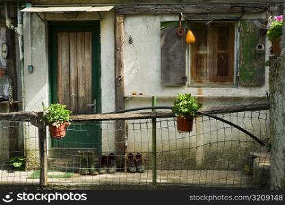 Chain-link fence in front of a house, Vernazza, La Spezia, Liguria, Italy