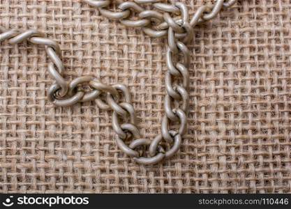 chain on a linen canvas as a background texture