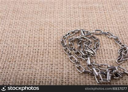 chain on a linen canvas as a background texture