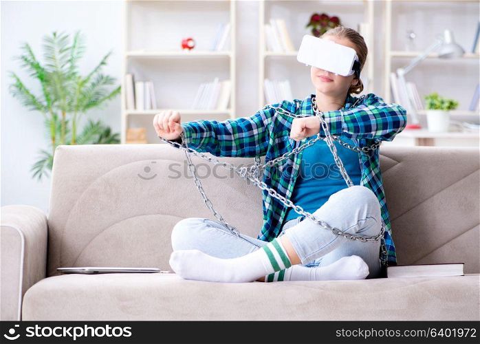 Chained female student with virtual glasses sitting on the sofa