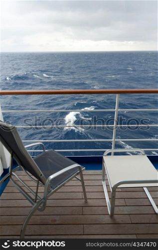 Chair and a stool on the deck of cruise ship Silver Shadow, East China Sea