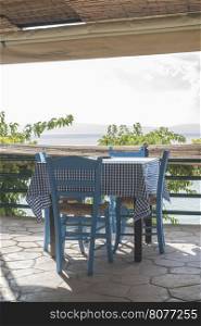Chair in greek taverna on a beach. Greece