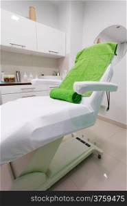 Chair in modern healthy beauty spa salon. Interior of treatment room. Luxury relax therapy.