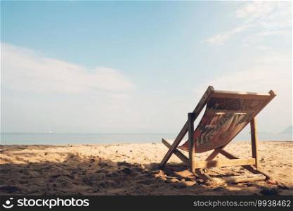chair on the sandy beach in sunny day