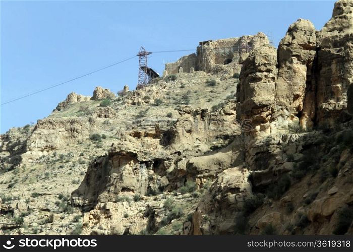 Chairlift and ruins of zoroastrian temple Qal&rsquo;eh-e Doktar