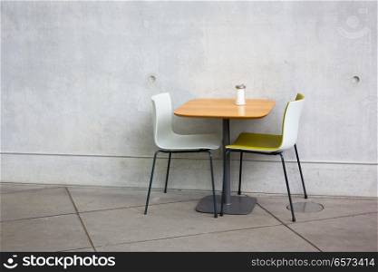chairs and table at open-air cafe