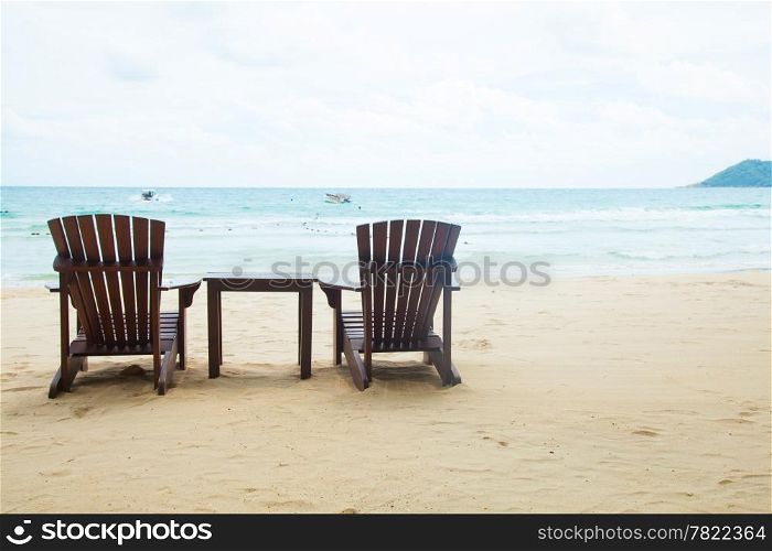 Chairs and table. Located on the sandy beach. Attached to the sea during the holidays.
