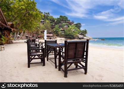 Chairs and table on the sand beach with blue sky. Koh Phangan, Thailand&#xA;