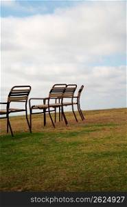 Chairs on grassland