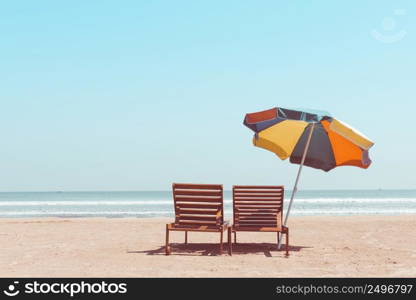 Chairs on sea beach with copy space vintage toned