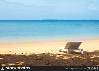 chaise lounge on a beach at summer day