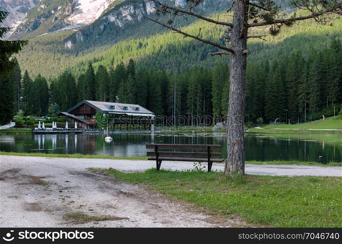 Chalet in Mosigo Lake in San Vito di Cadore inside Italian Dolomites Alps Scenery in Summer Time