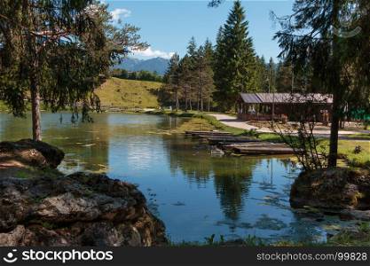 Chalet in Mosigo Lake in San Vito di Cadore inside Italian Dolomites Alps Scenery in Summer Time