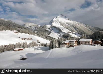 Chalets in the village of Warth-Schrocken, and Mount Biberkopf, Warth am Alberg,Vorarlberg, Austria