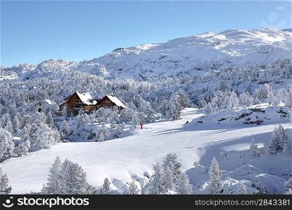 Chalets on snowy mountain