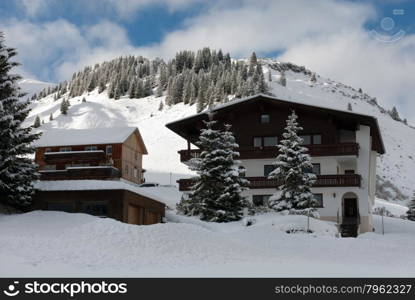 Chalets on the side of a mountain, near the village of Warth-Schrocken, in Austria