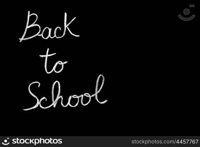 Chalkboard with phrase, back to school conceptual abstract black background, handwriting font, study &amp; education