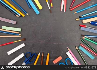 Chalkboard with school tools