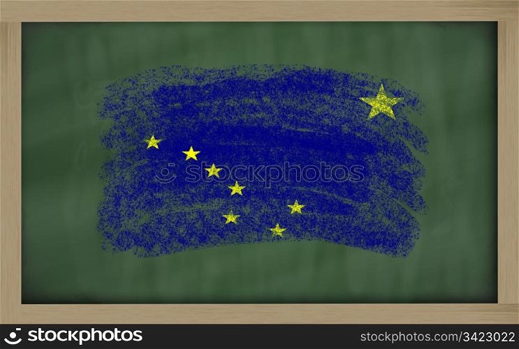 Chalky american state of alaska flag painted with color chalk on old blackboard