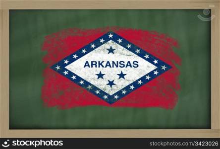 Chalky american state of arkansas flag painted with color chalk on old blackboard