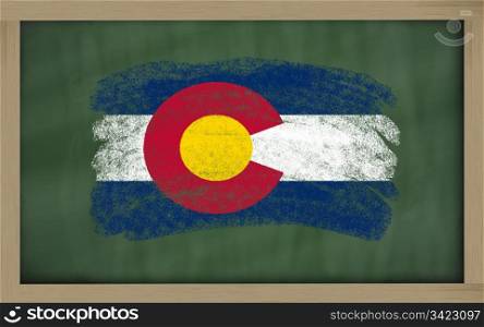 Chalky american state of colorado flag painted with color chalk on old blackboard