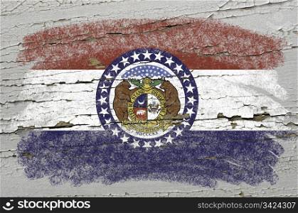 Chalky american state of missouri flag precisely painted with color chalk on grunge wooden texture