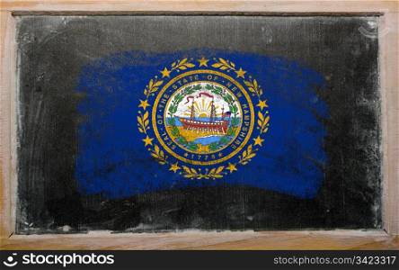 Chalky american state of new hampshire flag painted with color chalk on old blackboard