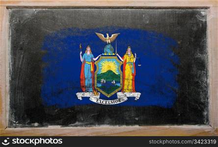 Chalky american state of new york flag painted with color chalk on old blackboard