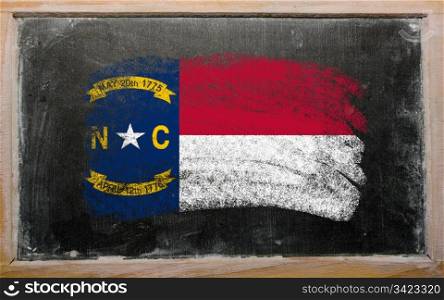 Chalky american state of new york flag painted with color chalk on old blackboard