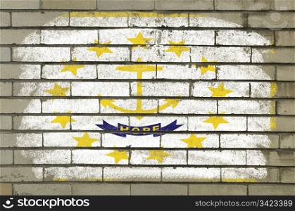 Chalky and grunge american state of rhode island flag painted with color chalk on brick wall