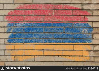 Chalky armenian flag painted with color chalk on grunge old brick wall