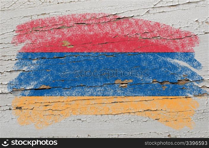 Chalky armenian flag painted with color chalk on grunge wooden texture