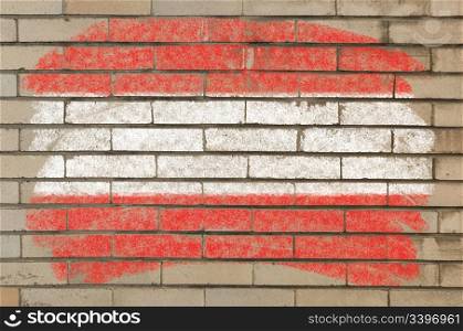 Chalky austrian flag painted with color chalk on grunge old brick wall