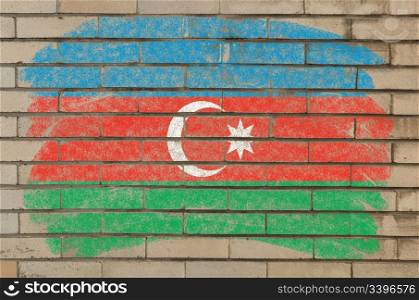 Chalky azerbaijan flag painted with color chalk on grunge old brick wall