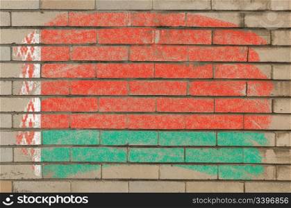 Chalky belarussian flag painted with color chalk on grunge old brick wall