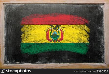 Chalky bolivian flag painted with color chalk on old blackboard