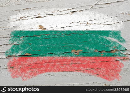 Chalky bulgarian flag painted with color chalk on grunge wooden texture