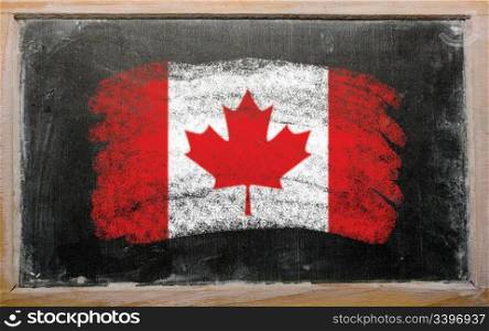Chalky canadian flag painted with color chalk on old blackboard