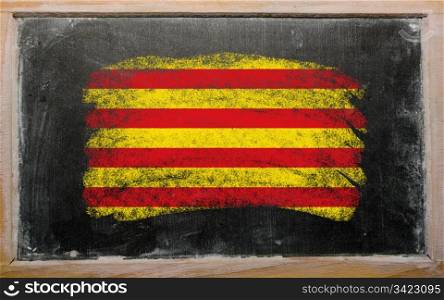 Chalky catalonia flag painted with color chalk on old blackboard