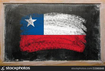 Chalky chile flag painted with color chalk on old blackboard