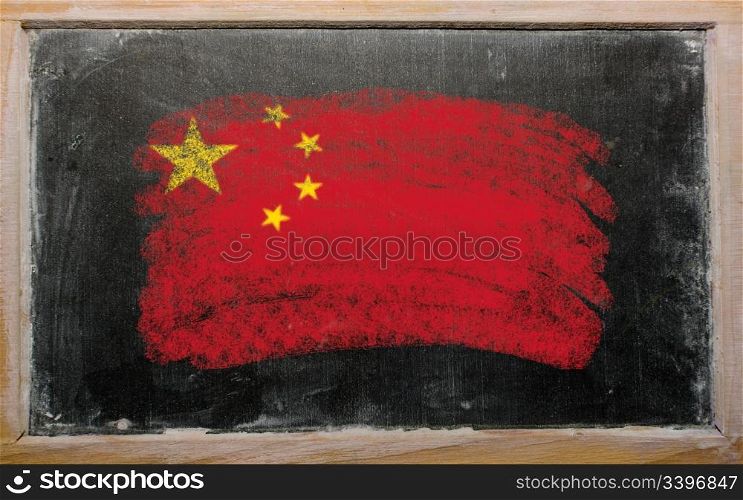 Chalky chinese flag painted with color chalk on old blackboard