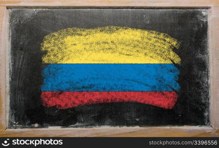 Chalky columbian flag painted with color chalk on old blackboard