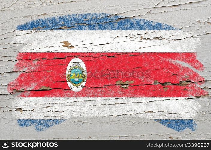 Chalky costa rica flag painted with color chalk on grunge wooden texture