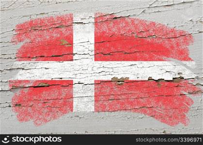 Chalky danish flag painted with color chalk on grunge wooden texture