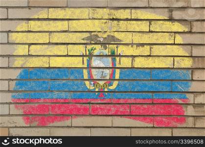 Chalky ecuadorian flag painted with color chalk on grunge old brick wall
