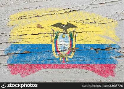 Chalky ecuadorian flag painted with color chalk on grunge wooden texture
