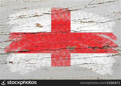 Chalky english flag painted with color chalk on grunge wooden texture