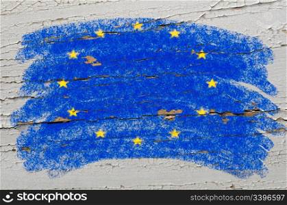 Chalky european union flag painted with color chalk on grunge wooden texture