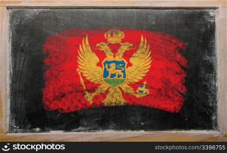 Chalky flag painted with color chalk on old blackboard