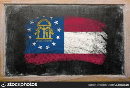 Chalky georgian flag painted with color chalk on old blackboard